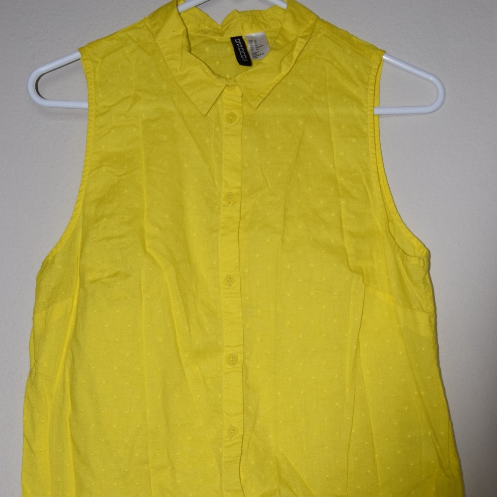 Yellow buttoned down collared shirt